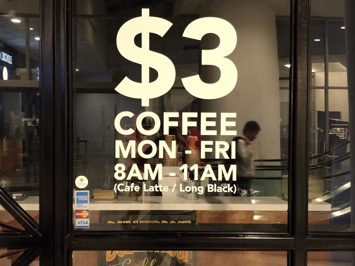 $3 coffee promotion on the window at The Sail
